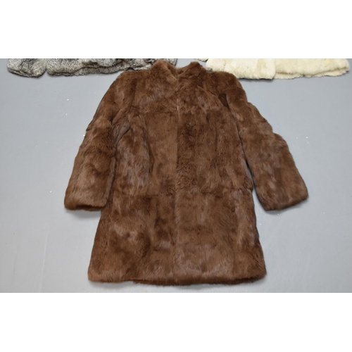 505 - A Selection of Three Size 10 Rabbit Fur Coats. Includes One Cream, One Grey and One Brown.