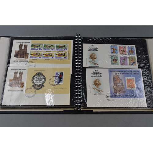 517 - A Folder Containing A Selection of Commonwealth Elizabeth II 25th Coronation Anniversary First Day C... 