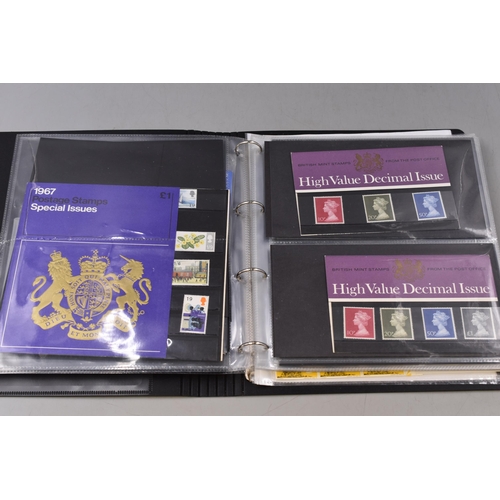 524 - A Binder Containing A Selection of Stamp Presentation Packs, Stamp Postcards and More. With A Hardba... 