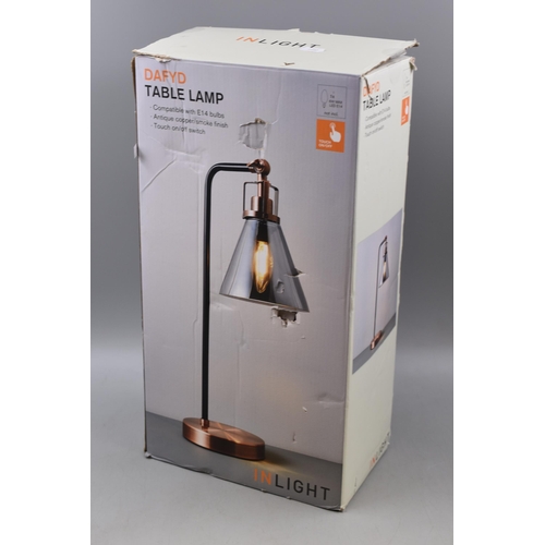 662 - A Boxed Dafyd Black and Copper Effect Adjustable Touch Table Lamp, With Smokey Glass Shade. Approx 1... 