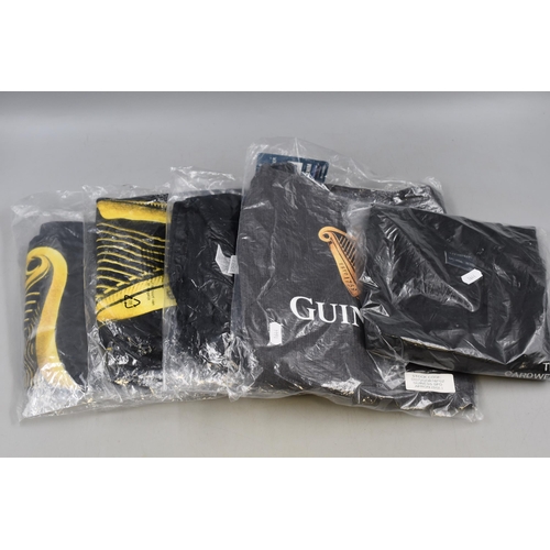 800 - A Selection of Three Guinness T-Shirts, Guinness Apron and Local Pub Polo Shirt.