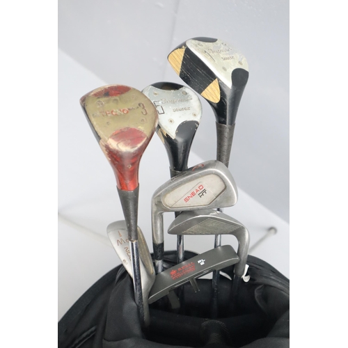 740 - A Golf Bag Containing A Selection of Left Handed Golf Clubs, Balls and Tees.