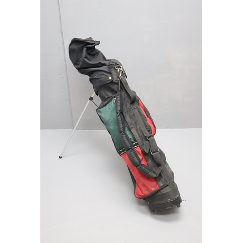 740 - A Golf Bag Containing A Selection of Left Handed Golf Clubs, Balls and Tees.