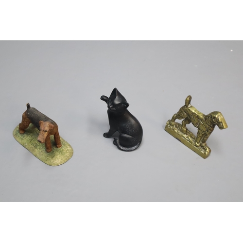 844 - A Mixed Selection to Include Ceramic Dogs, Crystal Ware, Brass Dog Door Stop and More.