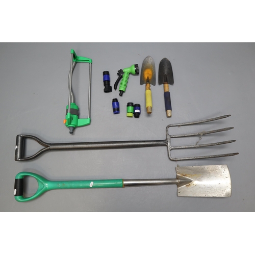 749 - A Selection of Gardening Equipment. Includes Trowels, Spade, Fork and More.