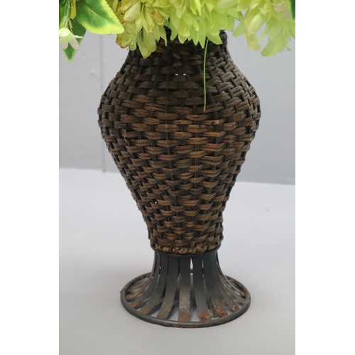 199 - Various Synthetic Flowers in Wicker Flower Pot