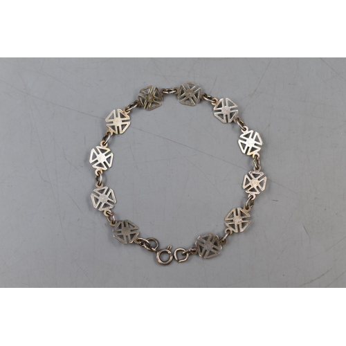 44 - A Sterling Silver Maltese Cross Bracelet.