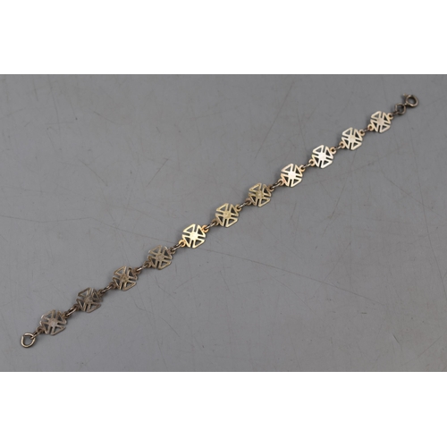 44 - A Sterling Silver Maltese Cross Bracelet.