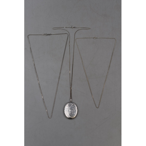 47 - An Etched Silver Locket, With Three 925. Silver Necklace Chains.