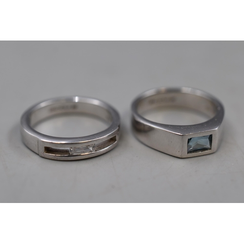 74 - Two Designer 925. Silver 'Accu.2' Rings, One Clear Stoned and One Blue Stoned. Both Size N.