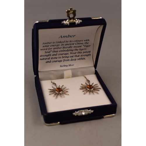 82 - A Pair of Sterling Silver Amber Stoned Sun Earrings, In Presentation Box.