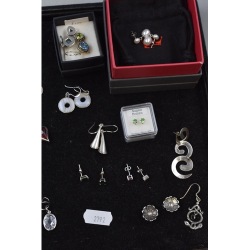 150 - Sixteen Pairs of Assorted Silver Earrings, With Two Unpaired Silver Earrings.