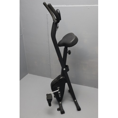 581 - Bike-X Exercise Bike with Digital Readout and Adjustable Pedal Tension Folds up for easy storage