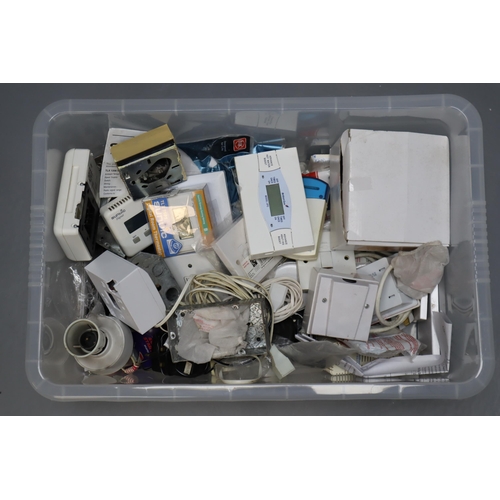 714 - A Large Selection of Assorted Electrical Fittings. Includes Thermostats, Switches, Plug Sockets and ... 