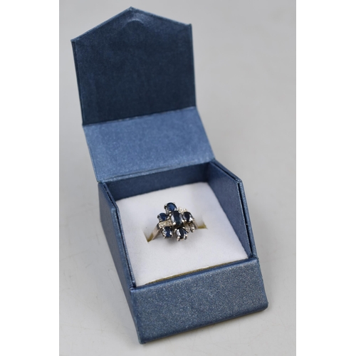 10 - Diamond and Sapphire Stoned Ring set in unmarked White Metal (Size K) Complete with Presentation Box