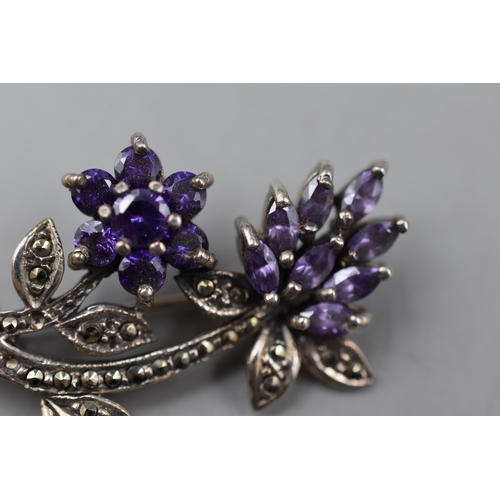 11 - A Sterling Silver Marcasite and Amethyst Floral Brooch, Some Stones Missing.