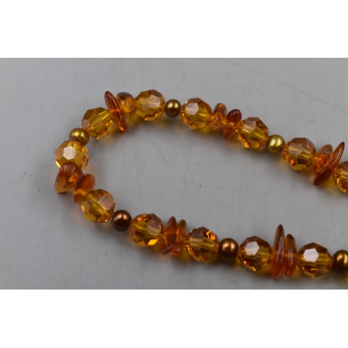 73 - An Amber and Pearl Beaded Necklace, With Sterling Silver Clasp