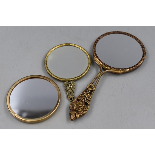 104 - Three Vintage Hand Mirrors with ornate Backs including Signed Oil by M E Hull