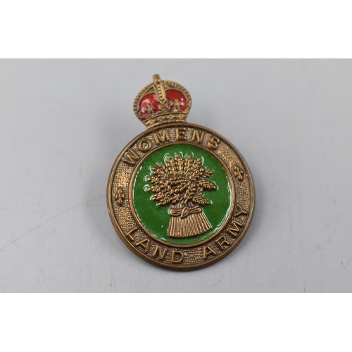 149 - A WWII Enamelled 'Women's Land Army' Badge