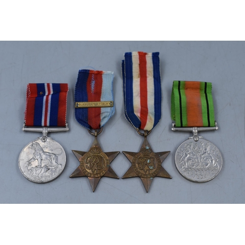 158 - Selection of WWII Medals, includes Two Star Medals, Defence Medal and Service Medal