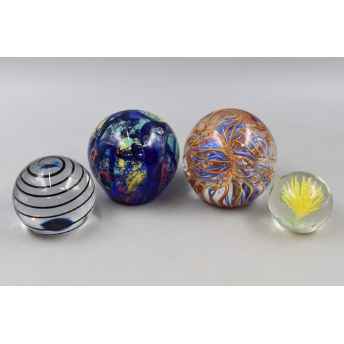 169 - Four Glass Ball Paperweights, Includes Floral, Spiral and More. AF.