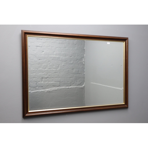 302 - A Bevel Edged Wood Framed Rectangular Wall Mirror, Approx 27.5