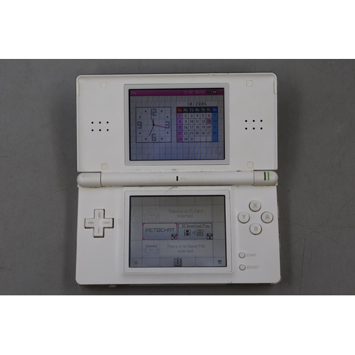 328 - A Nintendo DS Lite In White, With Charger. Powers On.