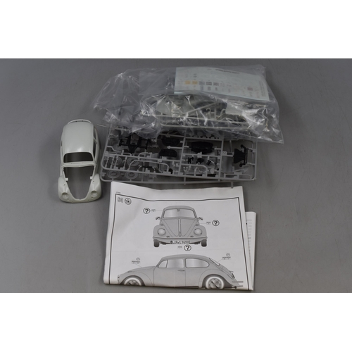 387 - Three Part made Vehicle model kits to include Revell VW Beetle limousine and a Hasegawa Toyota Celic... 