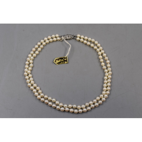 32 - A Designer 'Delta' Two Strand Faux Pearl Necklace, With Tag.