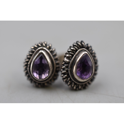 49 - A Pair of Sterling Silver and Amethyst Stud Earrings