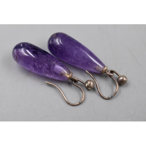 51 - A Pair of Unmarked Silver and Amethyst Drop Earrings