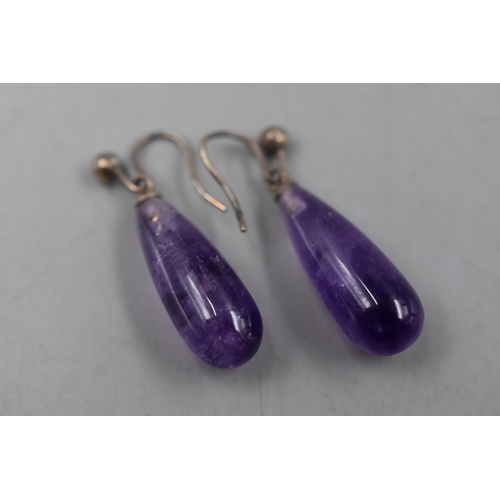 51 - A Pair of Unmarked Silver and Amethyst Drop Earrings