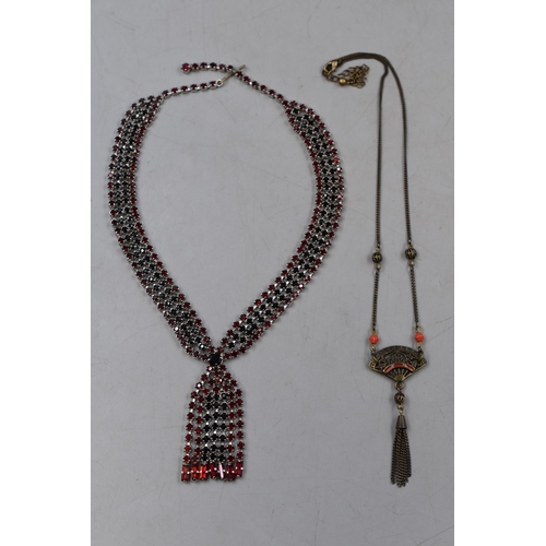 52 - Two Designer Necklaces. Includes Red and Black Crystal, And Oriental Style Fan.