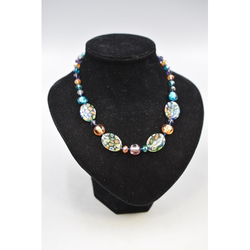 57 - A Murano Style Crystal and Millefiore Beaded Necklace