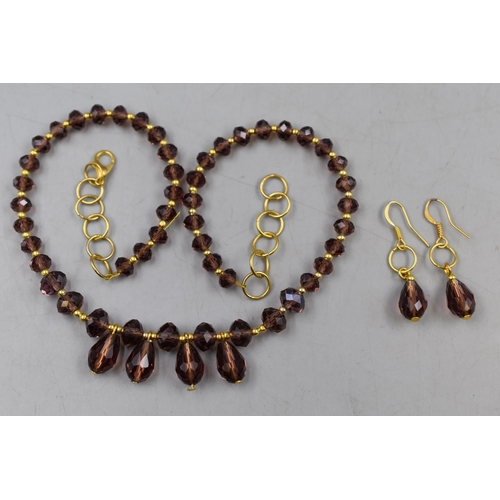 58 - A Designer Smokey Crystal Necklace and Earring Set