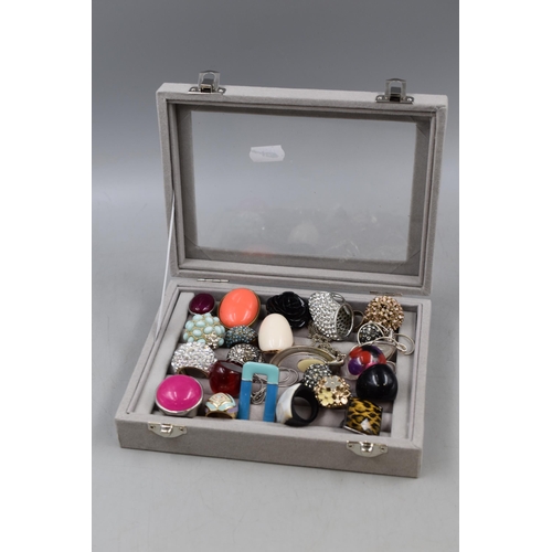 85 - A Velvet Effect Clear Topped Jewellery Box Containing A Selection of Unsorted Designer Jewellery.