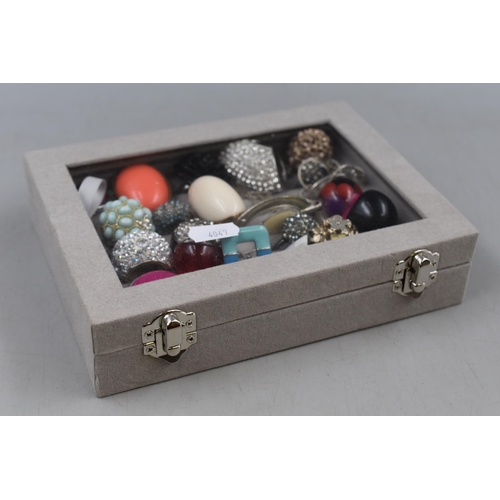 85 - A Velvet Effect Clear Topped Jewellery Box Containing A Selection of Unsorted Designer Jewellery.