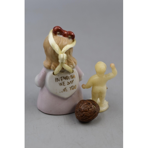 111 - Two Figures. Includes Little Girl German Porcelain Translation Figure and Plastic Boy Holding Basket... 