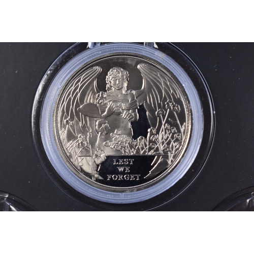 174 - The London Mint A War to End all Wars Coin Case containing a Elizabeth II Lest We Forget One Crown