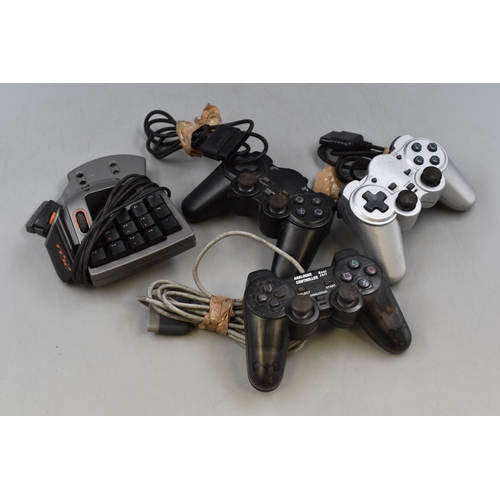 441 - A Box of Gaming Accessories. Includes Three Controllers and A SpeedPad n52.