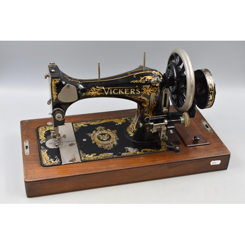 687 - A Vickers Modele de luxe sewing machine, in bentwood case