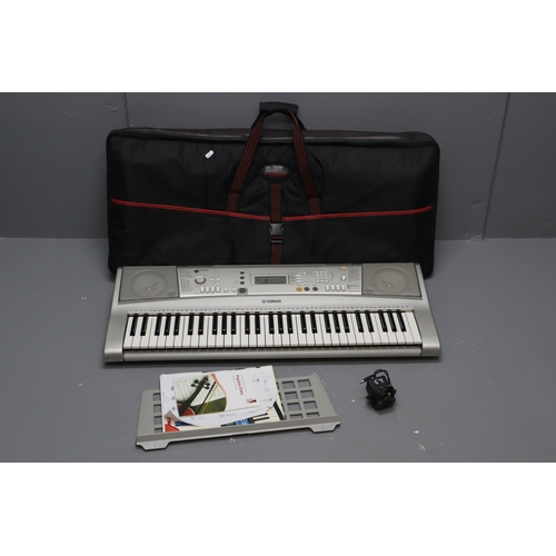 688 - A Yamaha PSR-E303 Electronic Keyboard, With Accessories In Keyboard Bag. Powers on When Tested