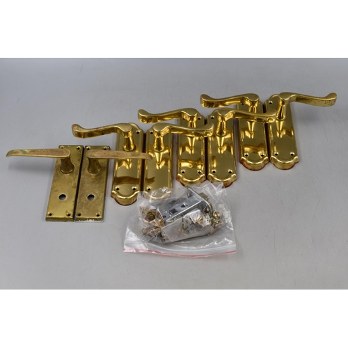 592 - Four pairs of Brass door Handles and some door Catches