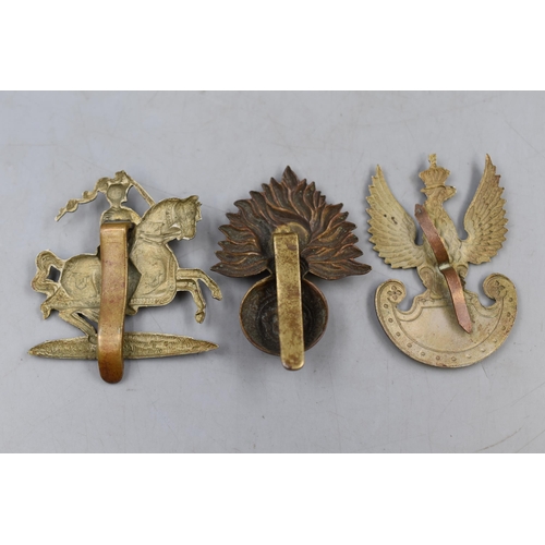 156 - Three Military Badges. Fife and Forfar Yeomanry, Polish Eagle and London Regiment Royal Fusliers.