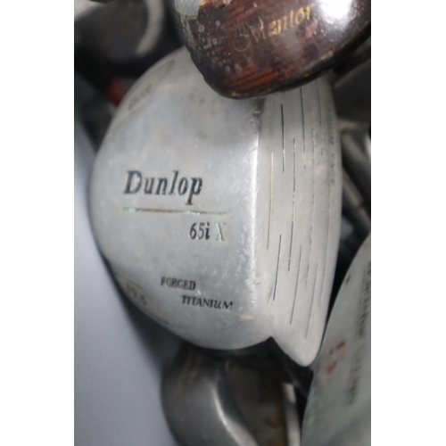 587 - A Large Selection of Golf Clubs and Golf Accessories. Includes Howson Bag, Golf Balls, Donnay Clubs ... 