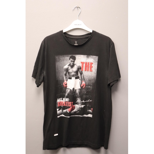 563 - official Pre Owned Mohamed Ali Promotional T-Shirt seems to be a size L