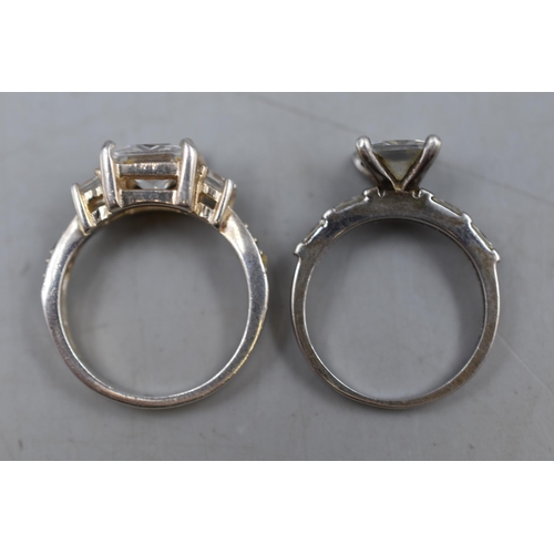 10 - Two Square Cut Clear Stoned 925. Silver Rings, Sizes J and L.