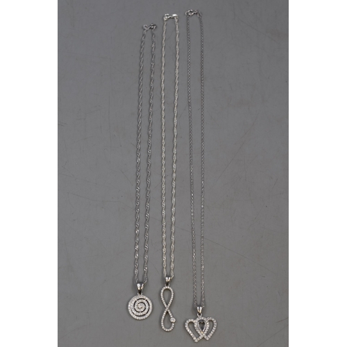 19 - Selection of Three Silver 925 Diamanté Pendants on Silver 925 Chains. Includes Infinity, Hear... 