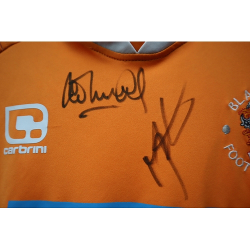 732 - A Signed Child's Blackpool FC Shirt, From Either 2010 or 2011.