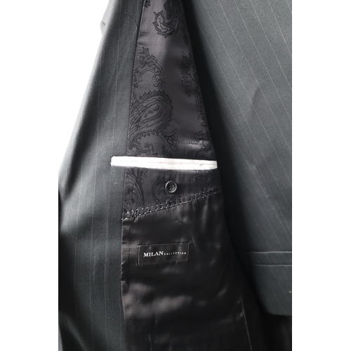 731 - A Black and Grey Pinstriped Milan Collection Three Piece Suit, In Suit Carrier. Jacket is Size 48R, ... 